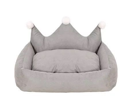 Gray pet bed with a crown design on a white background